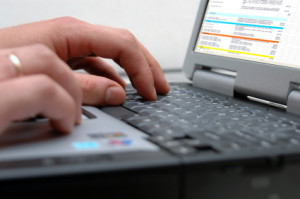 Man's hands on the keyboard of laptop